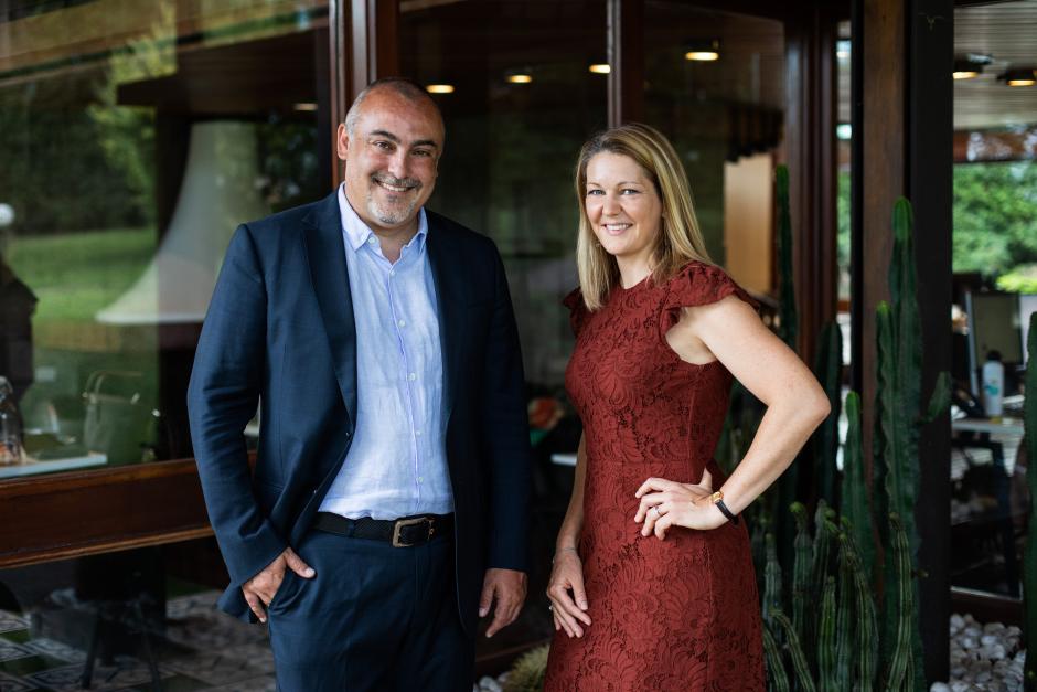 Translated Founders - CEO Marco Trombetti and Chairwoman Isabelle Andrieu - glass background with legs.jpg 